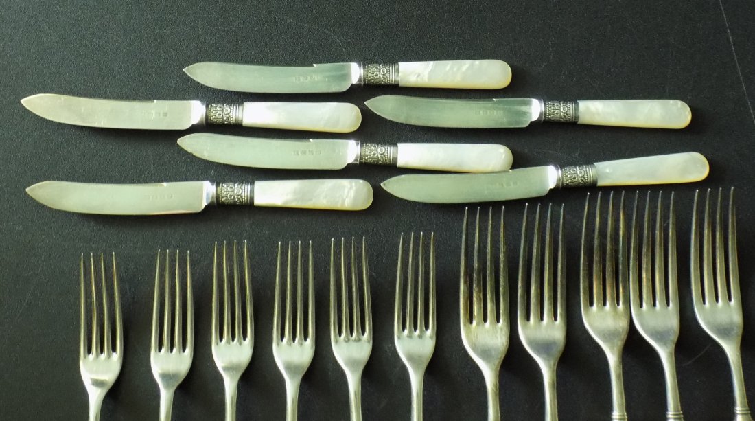 Nice lot of mother of pearl knives and forks. Landers, frary and Clark: Nice lot of mother of pearl knives and forks. Landers, frary and Clark. In very good original as found condition. Beautiful colors. Great quality and detail. Large forks measure 7 ½ inches and 