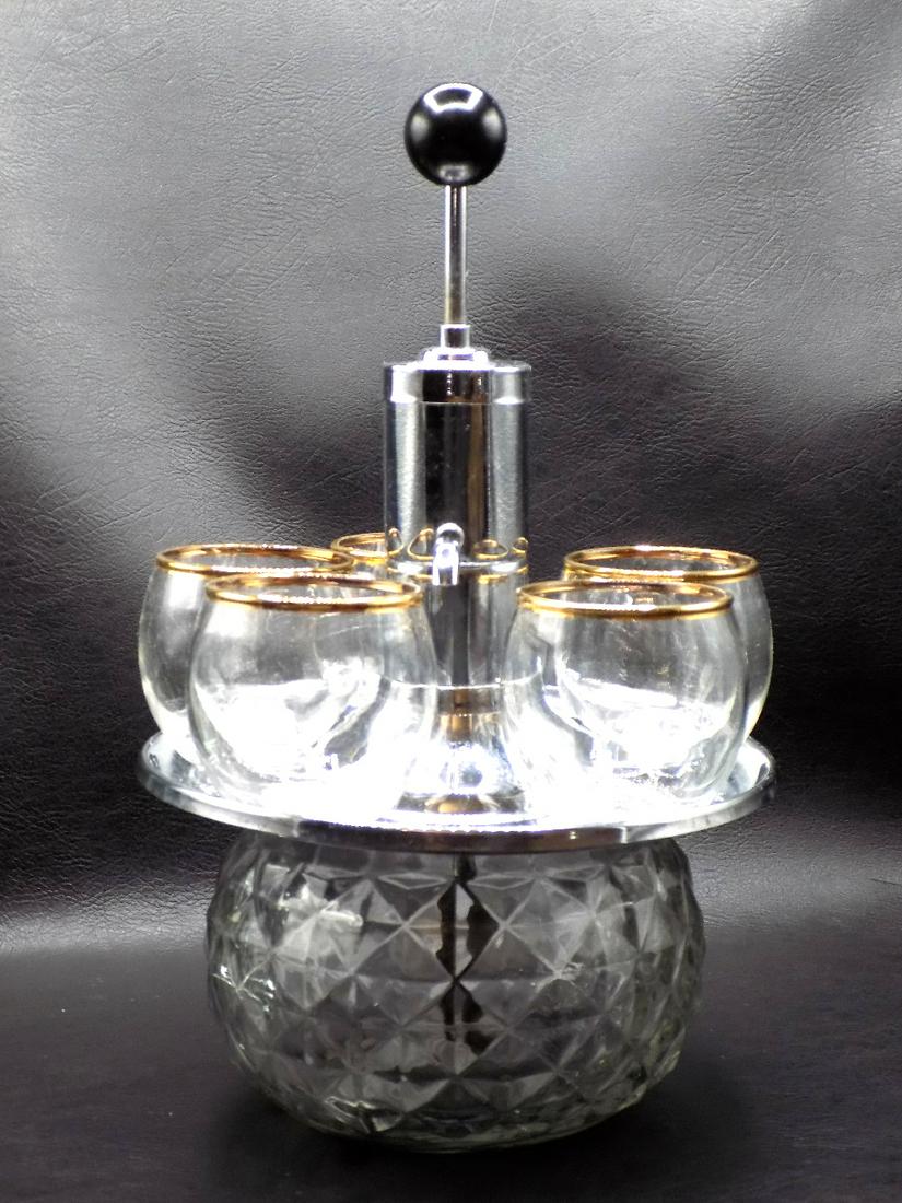 Vintage liquor set. Container with pump and five glasses: Vintage liquor set. Container with pump and five glasses. Great quality and detail. Marked on bottom as shown in photo, hard to read Murfreesboro? Glasses have gold decorated rims. Container 11 ¼