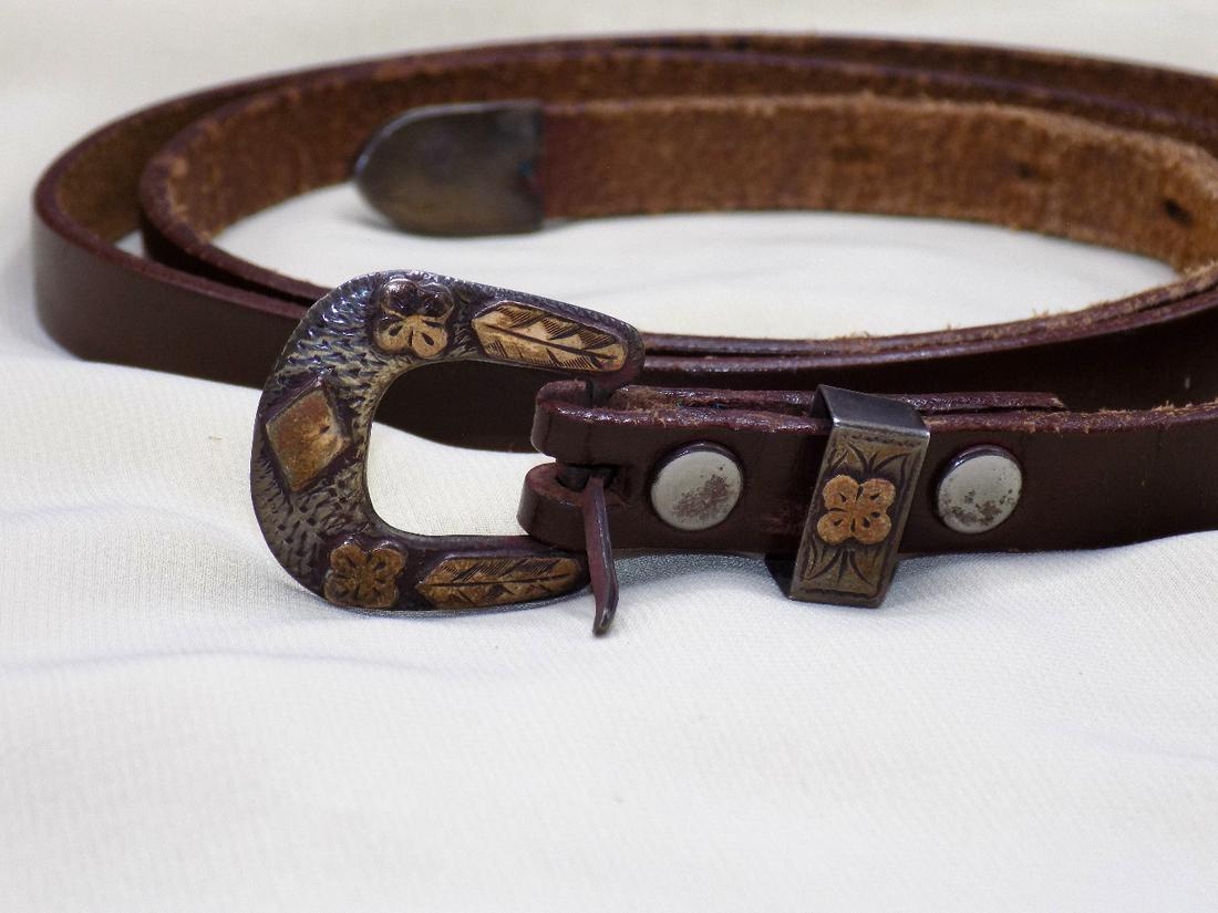 Vintage ladies’ gold on silver and leather belt: Vintage ladies’ gold on silver and leather belt. Not marked. Engraved gold applied to silver on buckle and end. Marked Made in Mexico. Total length 40 inches. Belt width ½ inch
