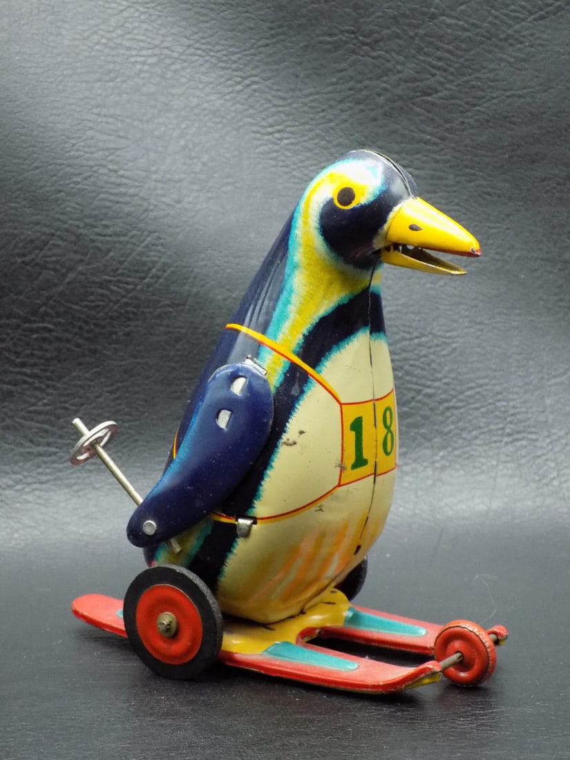 Vintage tin friction toy penguin Made In Japan: Vintage tin friction toy penguin Made In Japan. Marked as shown in photo. Great quality and detail. Working condition. 4 ¾ inches tall