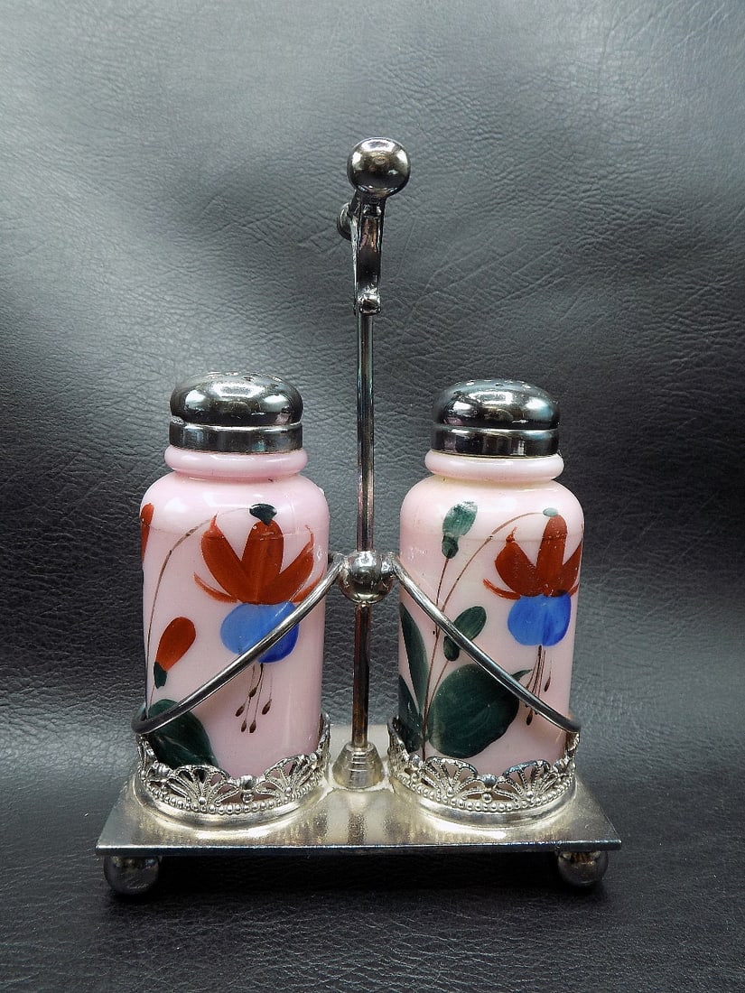 Antique hand painted salt and pepper shakers in silverplate frame: Antique hand painted salt and pepper shakers in silverplate frame. Marked Rockford Silver Co. Quadruple. Beautiful hand painted art glass shakers. Great quality and detail. 6 inches tall x 4 ¼ in