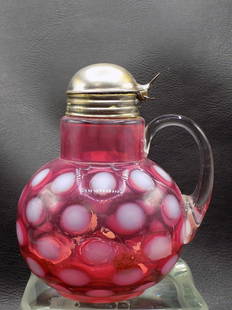 Antique cranberry and white coin spot art glass syrup pitcher: Antique cranberry and white coin spot art glass syrup pitcher. Clear applied handle. Hand blown. Beautiful colors. Great quality and detail. 5 &#190; inches tall