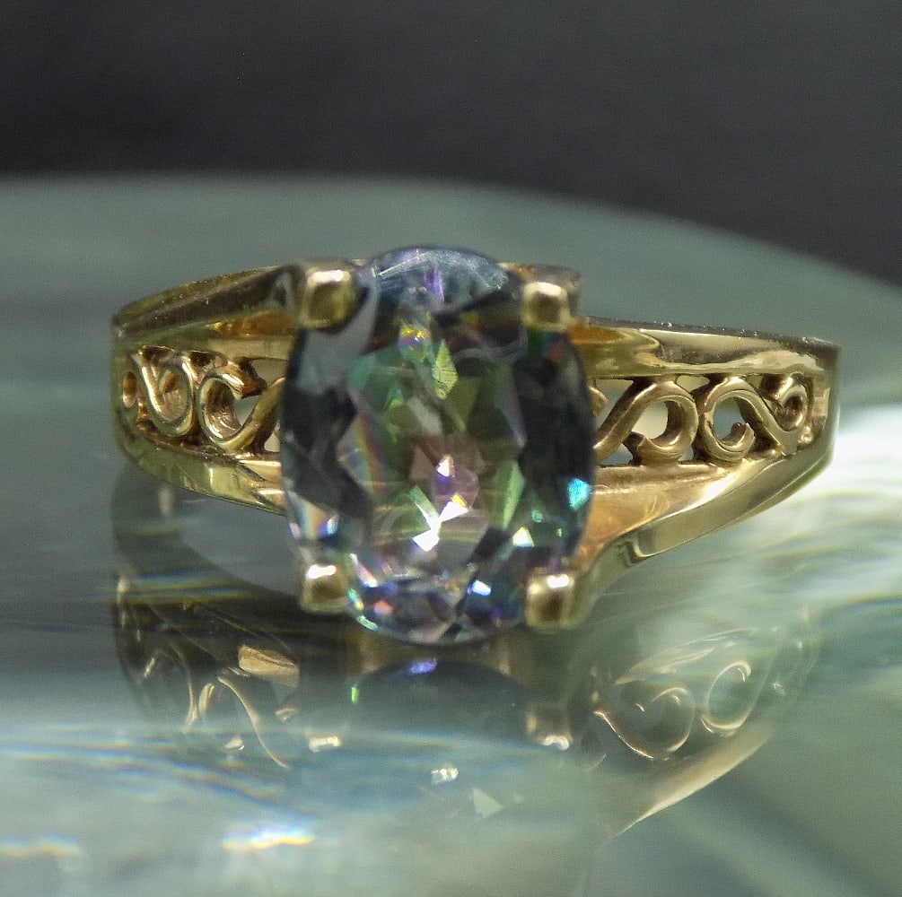 Beautiful 2 ct mystic topaz 10k gold ring.: Beautiful 2 ct mystic topaz 10k gold ring. Great quality and detail. Size 6 ¾.