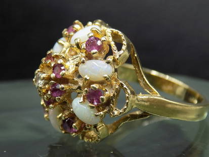 Beautiful ruby and fire opal 14k gold dinner ring: Beautiful ruby and fire opal 14k gold dinner ring. Great quality and detail. Size 7.