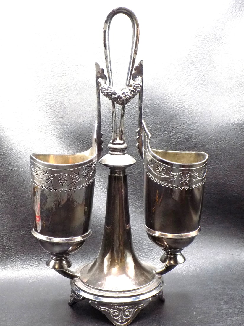 Unusual antique decorated silverplate double vase centerpiece: Unusual antique decorated silverplate double vase centerpiece. Marked Meriden on base as shown in photos. Great quality and detail. Minor wear to silverplate, from use and age. 12 ½ tall x 7 