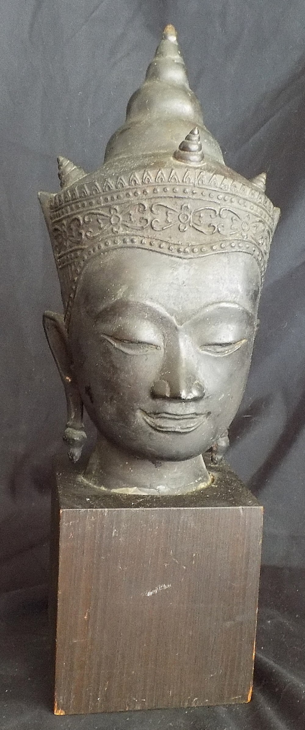 Handsome vintage metal Budha on wood base.: Handsome vintage metal Budha on wood base. Great quality and detail. Original patina. 16 inches tall x 4 wide