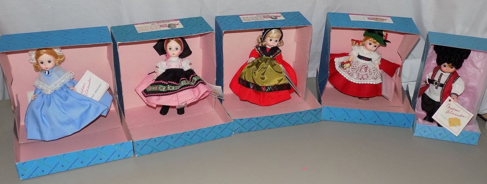 Five Vintage Madame Alexander International dolls: Five Vintage Madame Alexander International dolls . United States 559. Switzerland 594. Sweden 592. Yugoslavia 589. Miniature Cossack no number. Beautiful colors. Great quality and detail. Looks to be