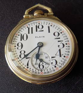 High grade Elgin B. W. Raymond Railroad grade 21 jewel pocket watch: High grade Elgin B. W. Raymond Railroad grade 21 jewel pocket watch. Montgomery porcelain dial has one light hairline as shown in photo. Runs part time. Probably needs cleaned. Gold fill case. Please