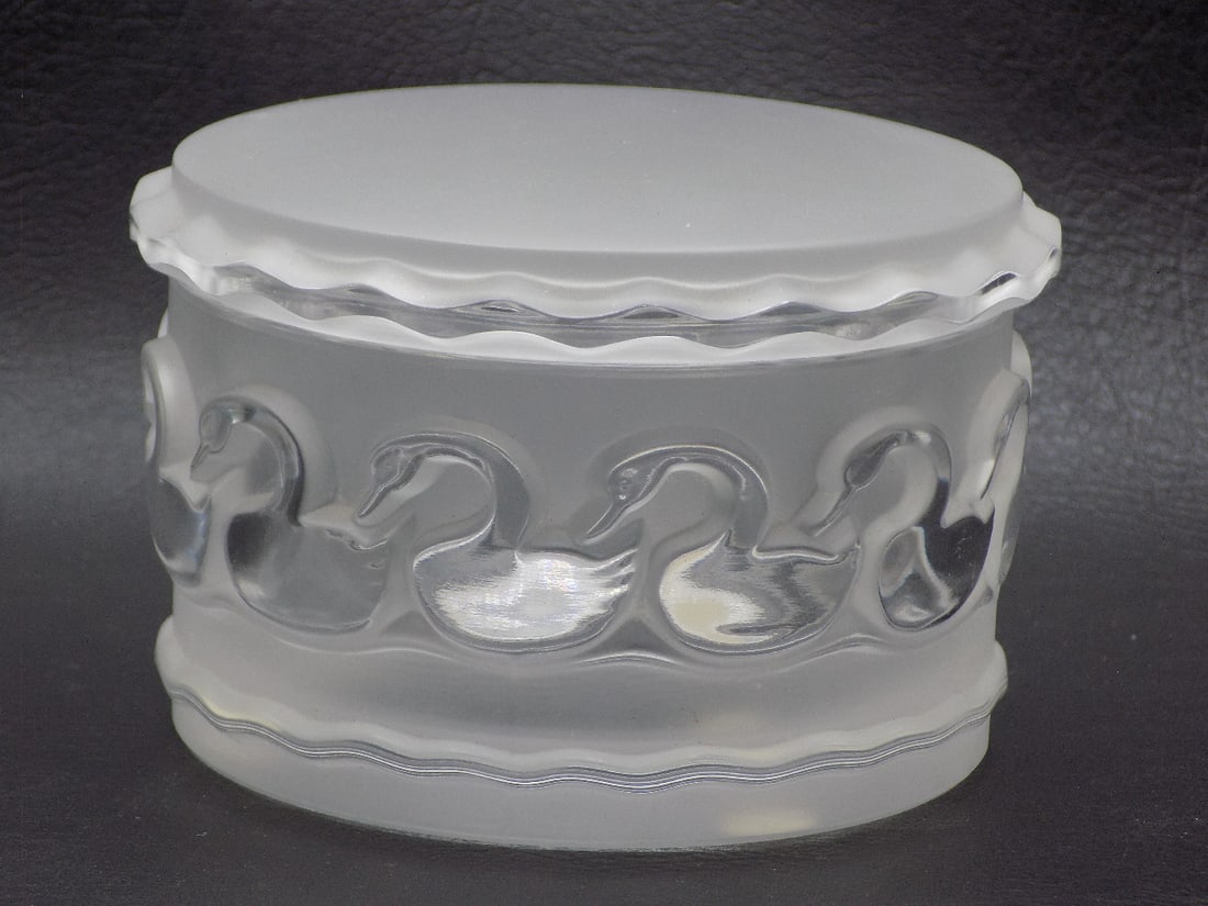 Vintage signed Lalique art glass jewelry box with swans: Vintage signed Lalique art glass jewelry box with swans. Signed as shown in photos. Great quality and detail. In very good original as found condition. 2 3/8 tall x 4 inches diameter