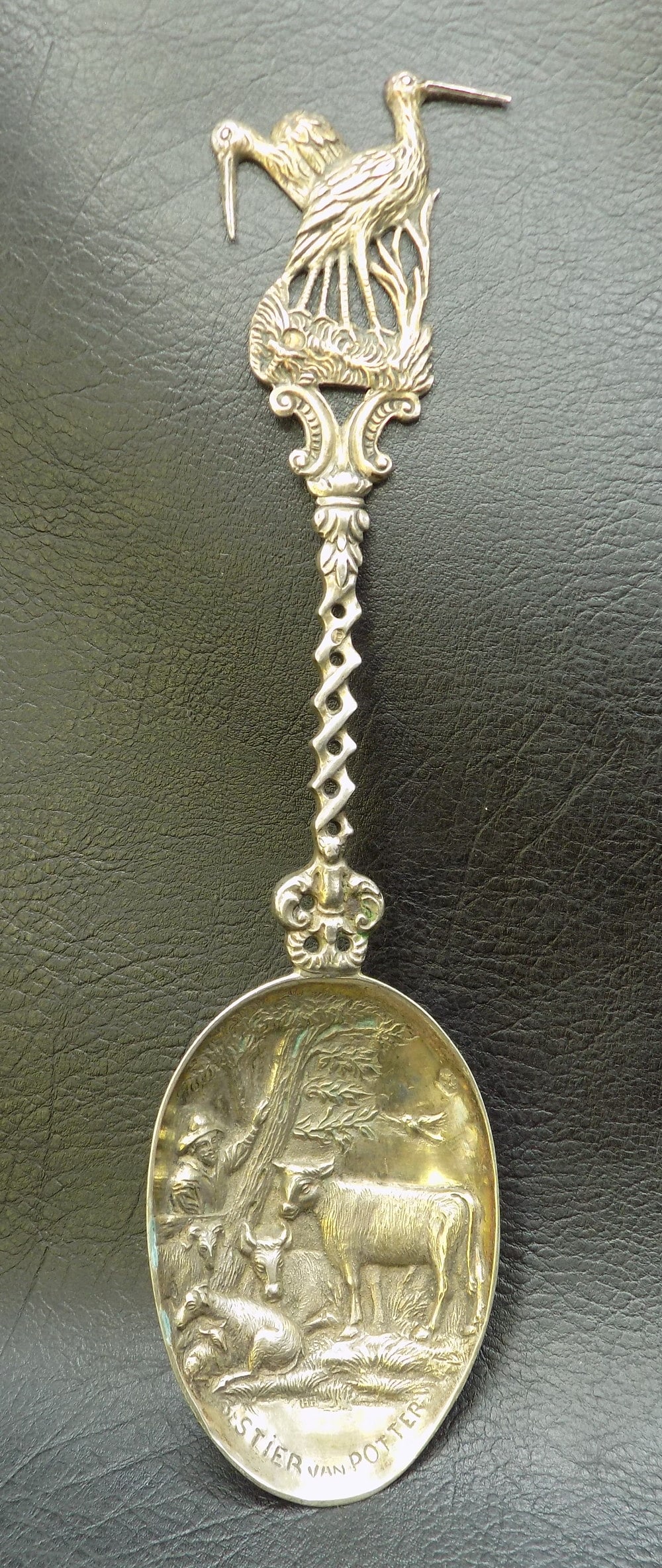 Fancy vintage sterling silver spoon. With two cranes at top.: Fancy vintage sterling silver spoon. With two cranes at top. Three dimensional cattle. Elaborately decorated. Sterling touchmarks as shown in photo. Great quality and detail. In very good original as 