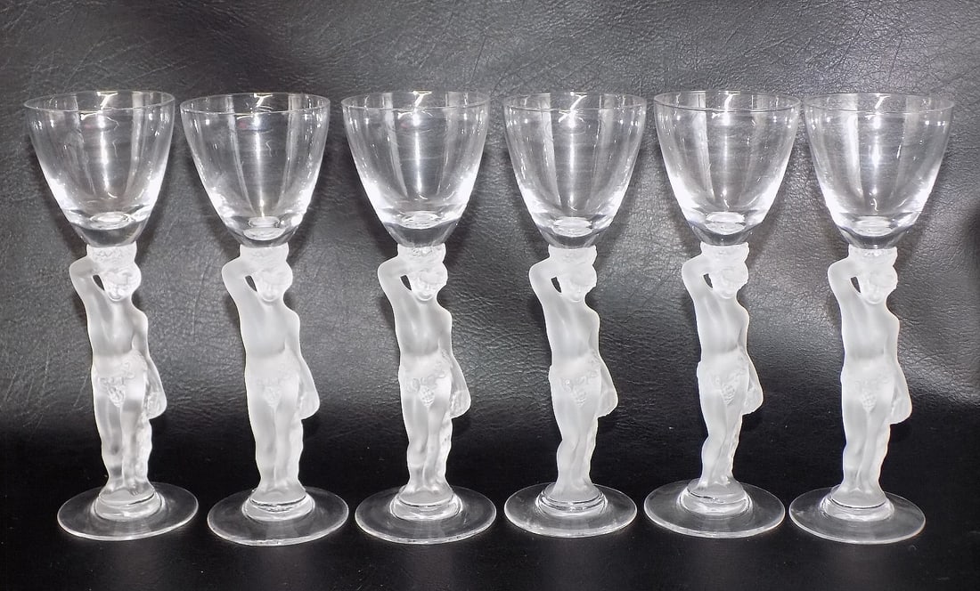 Six vintage Lalique looking female figural wine glasses stemware: Six vintage Lalique looking female figural wine glasses stemware. In very good original as found condition. Great quality and detail. No maker markings. 6 inches tall x 2 inches wide at top