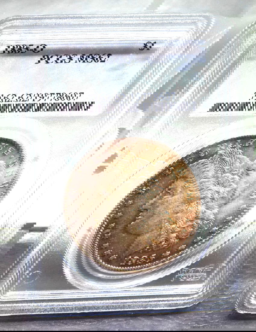 Uncirculated 1885 O Morgan PCGS graded MS62 silver dollar. (1 of 4)