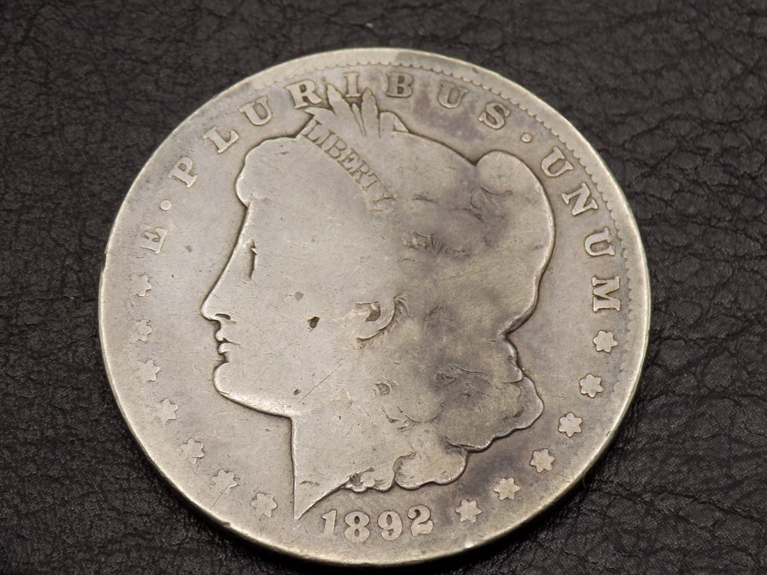 1892 CC Morgan silver dollar.  Please see photos to grade for yourself (1 of 2)