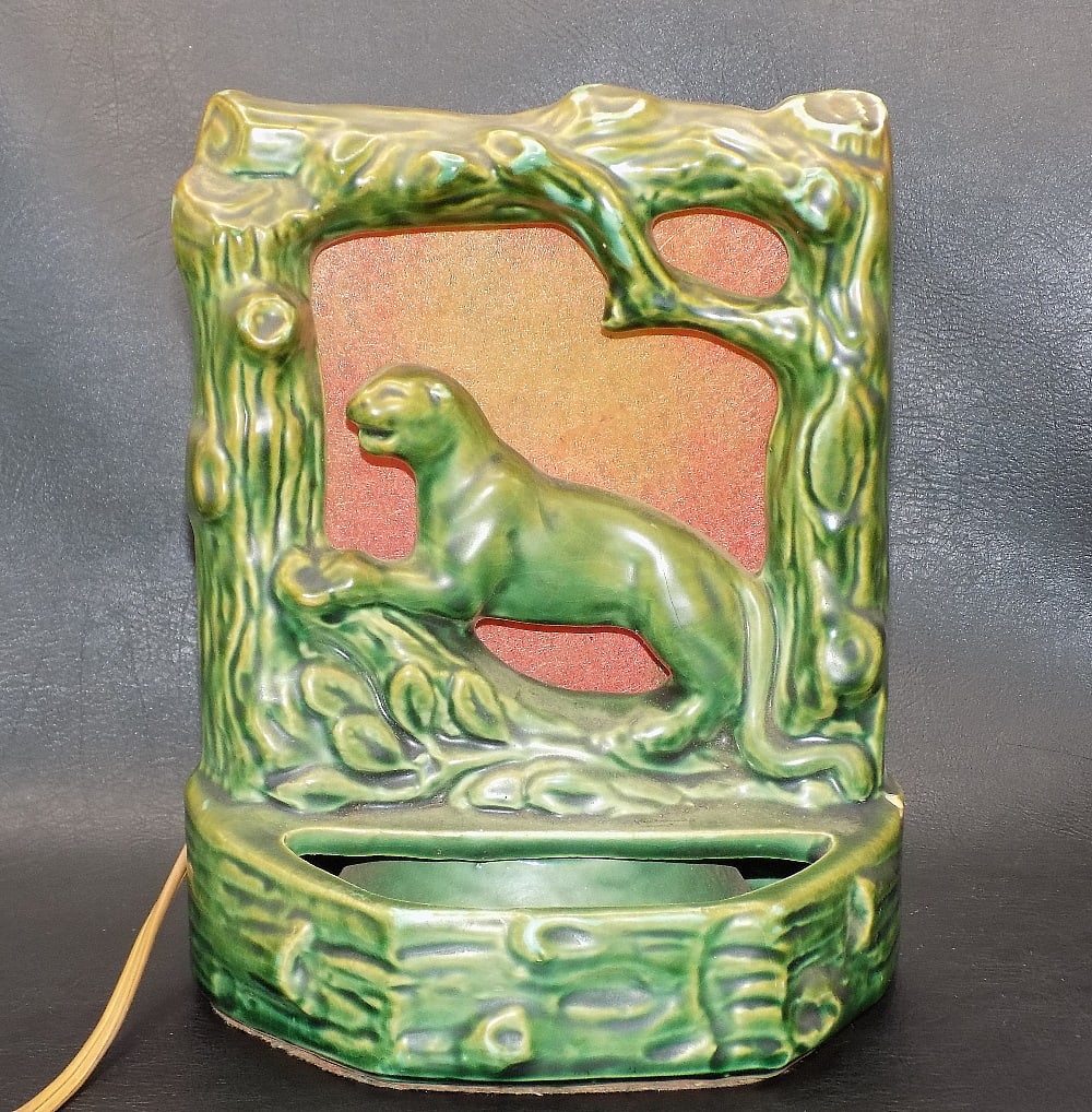 Wonder vintage Haegar art pottery panther lamp: Wonder vintage Haegar art pottery panther lamp. Beautiful color. Great quality and detail. In very good original as found condition with one small fleabite chip on back of lamp. Please see photos. 8 &