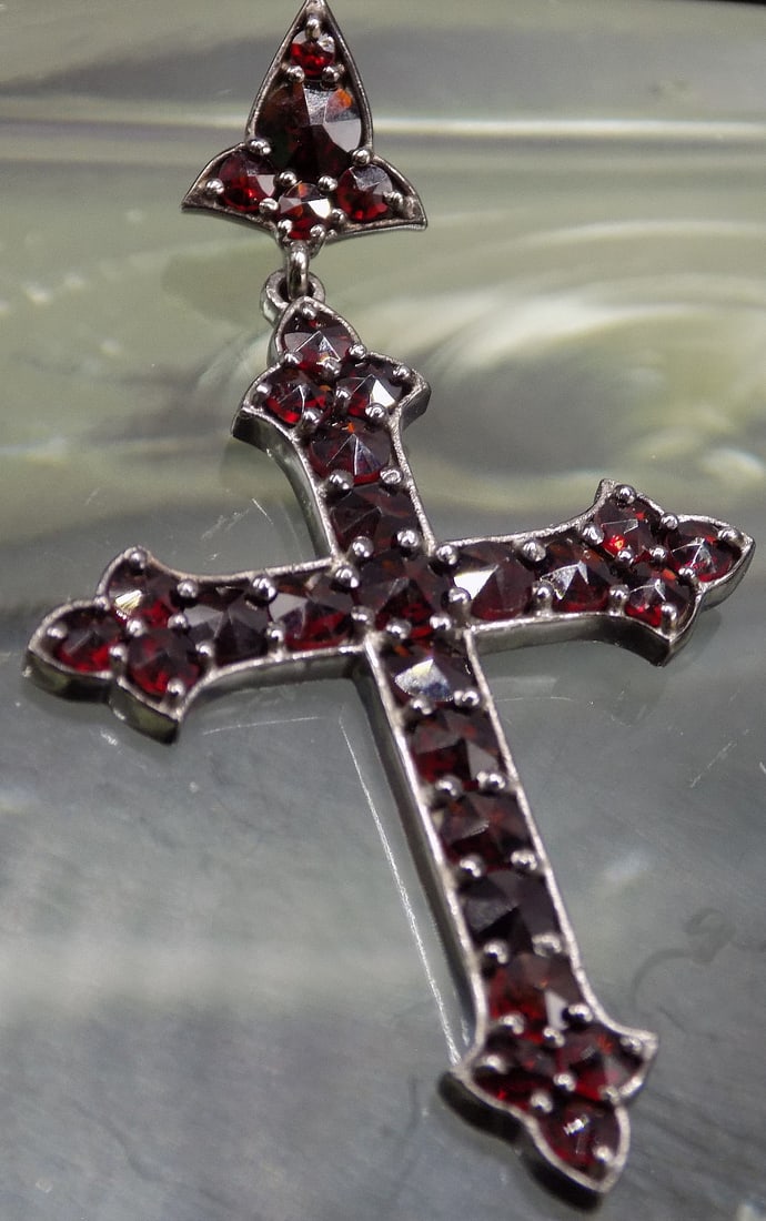 Beautiful garnet and sterling cross pendant: Beautiful garnet and sterling cross pendant. Great quality and detail. 2 inches tall x 1 1/8 wide
