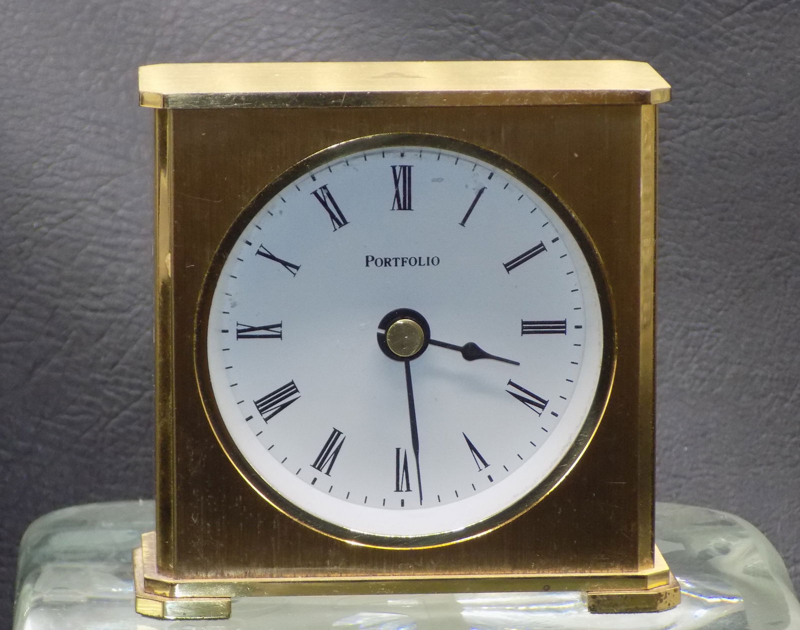 Neat Tiffany and Co. Portfolio clock: Neat Tiffany and Co. Portfolio clock. Made in Germany. Running at time of listing. In very good original as found condition. See photos for back of works. Great quality and detail. 3 1/8 inches tall x