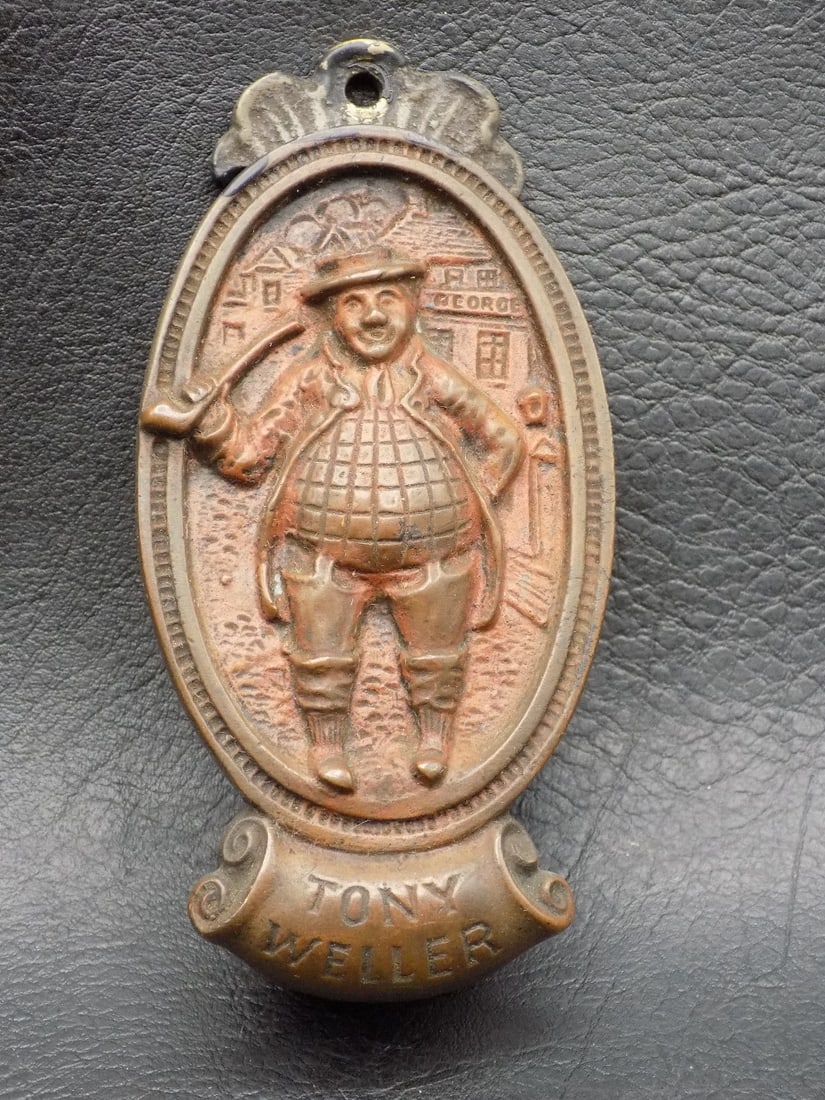 Unusual vintage Tony Weller cast iron door knocker: Unusual vintage Tony Weller cast iron door knocker. Marked on back as shown in photos. Great quality and detail. Original patina. 3 ½ tall x 1 ¾ wide