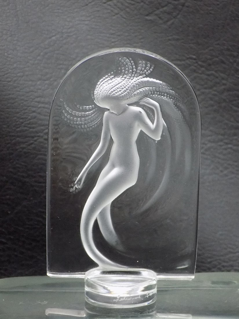 Lovely signed Lalique France art glass paperweight: Lovely signed Lalique France art glass paperweight. With nude woman in center. Marked on base as shown in photo. Great quality and detail. 3 5/8 tall x 2 1/8 inches wide