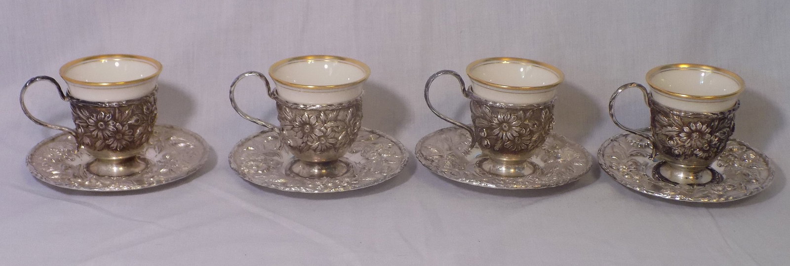Fabulous set of four S. Kirk and Son Repousse demitasse cups with saucers: Fabulous set of four S. Kirk and Son Repousse demitasse cups with saucers. Marked on bottom as shown in photos. No condition problems. Has some tarnish, normal from age, and is easily polished. Has on