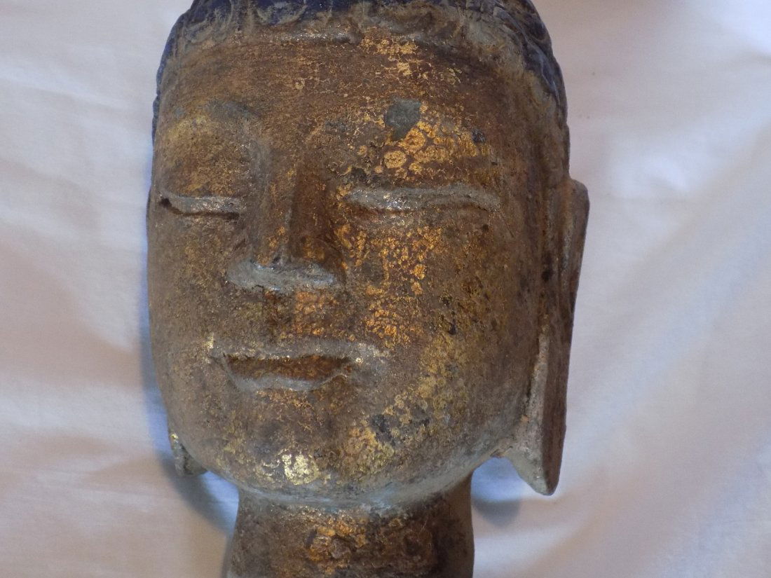 Ancient carved stone Buddha head (1 of 6)