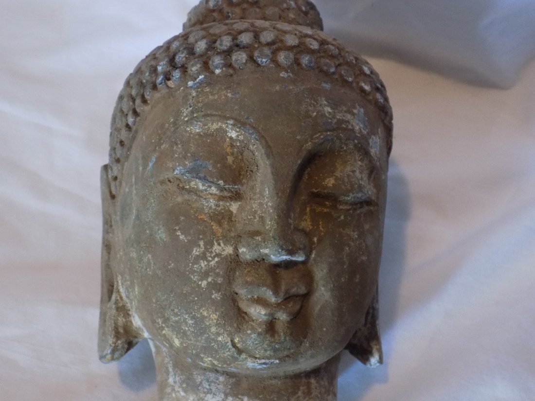 Ancient carved stone Buddha head (1 of 6)