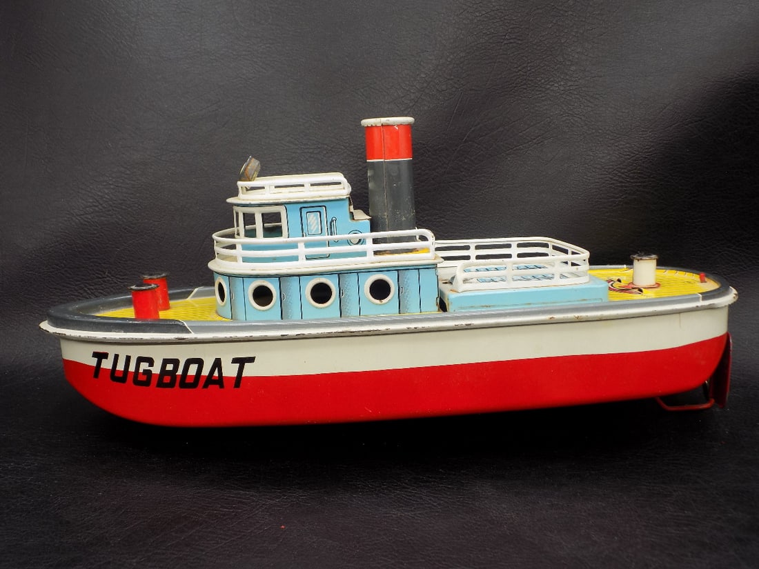 Vintage tin toy Tug Boat: Vintage tin toy Tug Boat. Marked San Made in Japan. Beautiful colors. Great quality and detail. 12 7/8 inches long