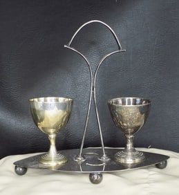 Unusual antique silverplated shot cups in carrier