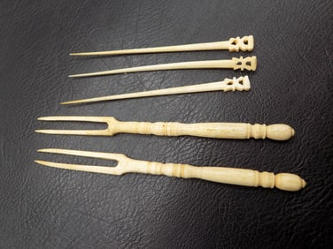 Four vintage Oriental hand carved hair pins