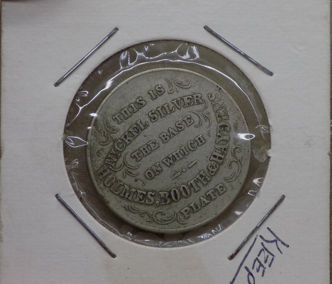 1899 Merchant token. Holmes Booth Haydens Nickel Silver: 1899 Merchant token. Holmes Booth Haydens Nickel Silver. Waterbury Connecticut. Please see photos for condition