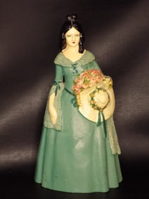 Pretty vintage cast iron doorstop of southern belle