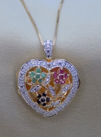 Beautiful emerald, ruby and sapphire sterling locket