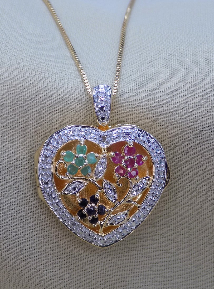 Beautiful emerald, ruby and sapphire sterling locket: Beautiful emerald, ruby and sapphire sterling locket. 7/8 inch wide. 17 inch chain. Great quality and detail. In very good original as found condition