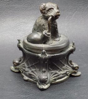 Unusual antique dog with bagpipe inkwell