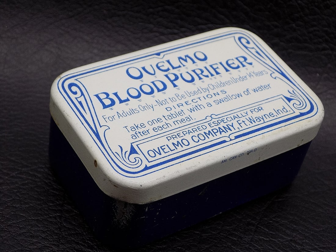Vintage Ovelmo Blood Purifier advertising tin: Vintage Ovelmo Blood Purifier advertising tin. Ft. Wayne Indiana. Great quality and detail. In very good original as found condition. 2 1/2 inches x 1 5/8 inches x 1 inch tall