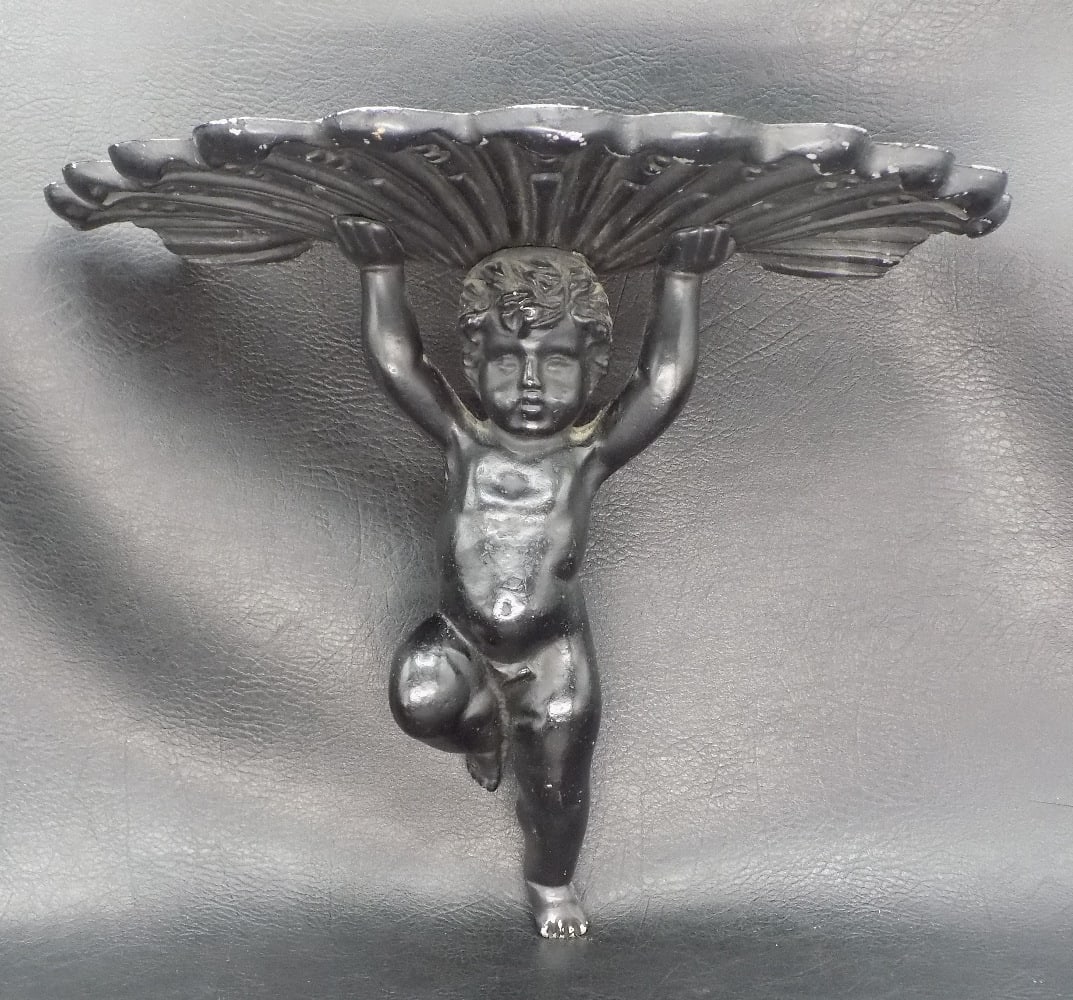 Very nice vintage cast iron figural wall sconce: Very nice vintage cast iron figural wall sconce. With shell shaped shelf held up by figure. Great quality and detail. Original patina. In very good original as found condition. 7 inches tall x 10 wide