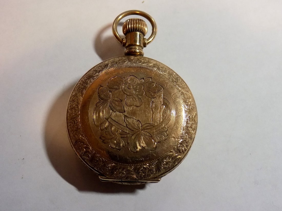 Fancy antique gold-filled hunting case Waltham pocket watch: Fancy antique gold-filled hunting case Waltham pocket watch. Running. Engraved. Porcelain dial. Please see photos for serial numbers. Great quality and detail. Dial 1 wide
