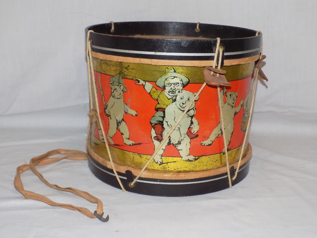 Rare Theodore Roosevelt antique tin drum with bears: Rare Theodore Roosevelt antique tin drum with bears. Also known as Teddy Roosevelt. Patriotic bears marching with American Flag. In very good original as found condition. Drum top restored. Please see