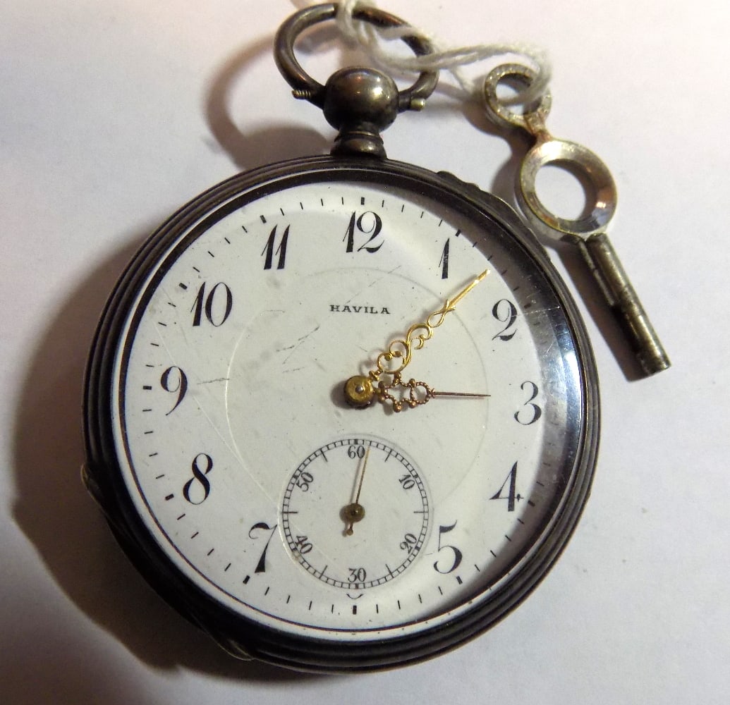Antique key wind 800 fine silver pocket watch: Antique key wind 800 fine silver pocket watch. Running part time at time of listing. Please see photos for serial numbers. Engraved on back. Eight ruby jeweled. Havila on porcelain dial. Light scratch