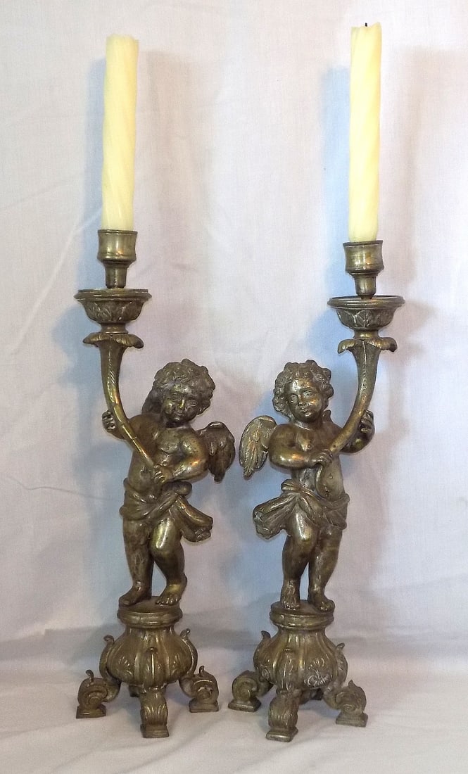 Rare Original pair of antique figural cupid candlesticks: Rare Original pair of antique figural cupid candlesticks. With cornucopias. Has original tags from estate. Please see photos to judge age and condition. Great quality and detail. In very good original