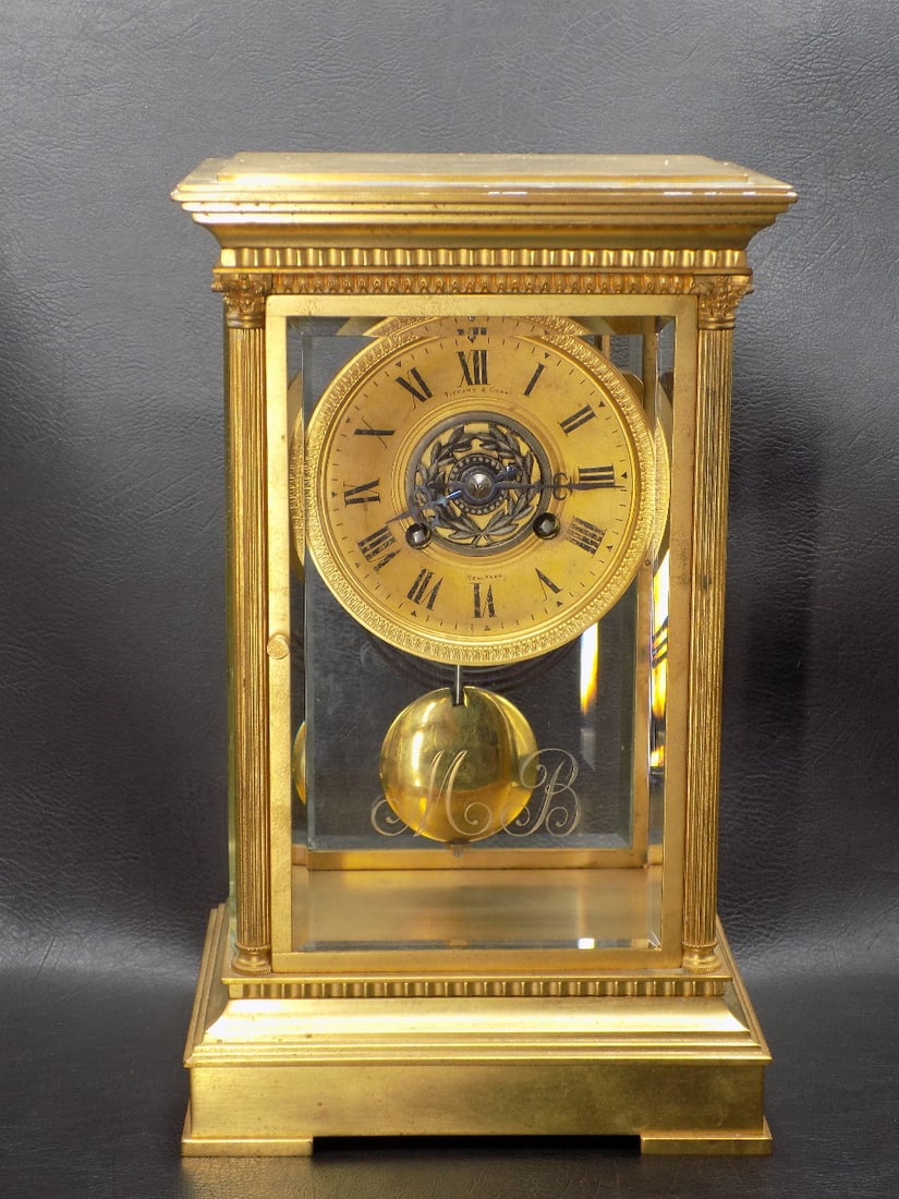 Wonderful signed Tiffany crystal regulator clock: Wonderful signed Tiffany crystal regulator clock. Signed Tiffany on dial and works as shown in photos. Running at time of listing. Great quality and detail. Pendulum has been replaced. 11 1/8 inches t