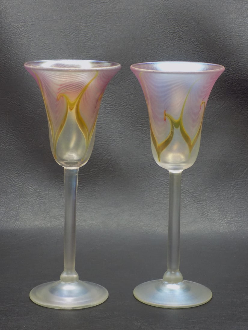 Fine pair of midcentury modern artist signed art glass wine glasses: Fine pair of midcentury modern artist signed art glass wine glasses. Artist signed Steven Correia as shown in photo. Pulled feather with beautiful iridescence. Great quality and detail. Beautiful colo