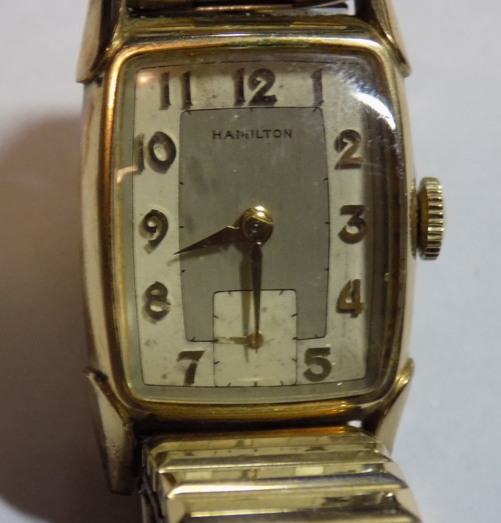 Vintage Hamilton 987 17 jewel 14k gold fill wristwatch: Vintage Hamilton 987 17 jewel 14k gold fill wristwatch. Running at time of listing. Adjustable band. could not remove back for fear of harming. Watch 3/4 wide, not including stem.