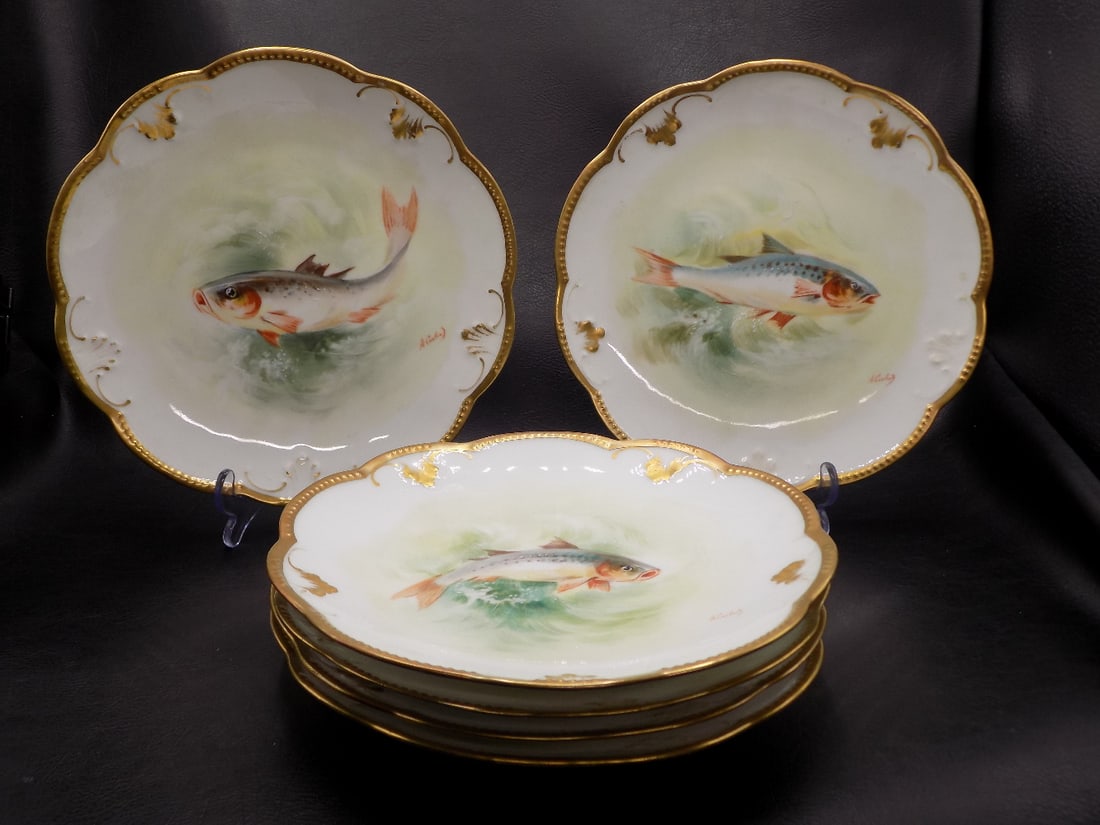 Lovely set of six vintage artist signed Limoge fish plates: Lovely set of six vintage artist signed Limoge fish plates. Artist signed and marked on back as shown in photos. Beautiful soft colors. Gold decorated rim. Great quality and detail. In very good origi