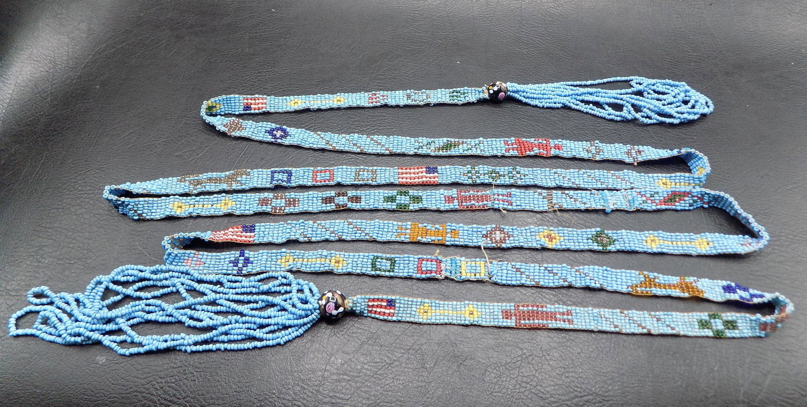 Vintage Native American Indian beaded necklace with American flag: Vintage Native American Indian beaded necklace with American flag. Great quality and detail. In very good original as found condition. Extremely long. Total length 88 inches x 3/8 inches wide