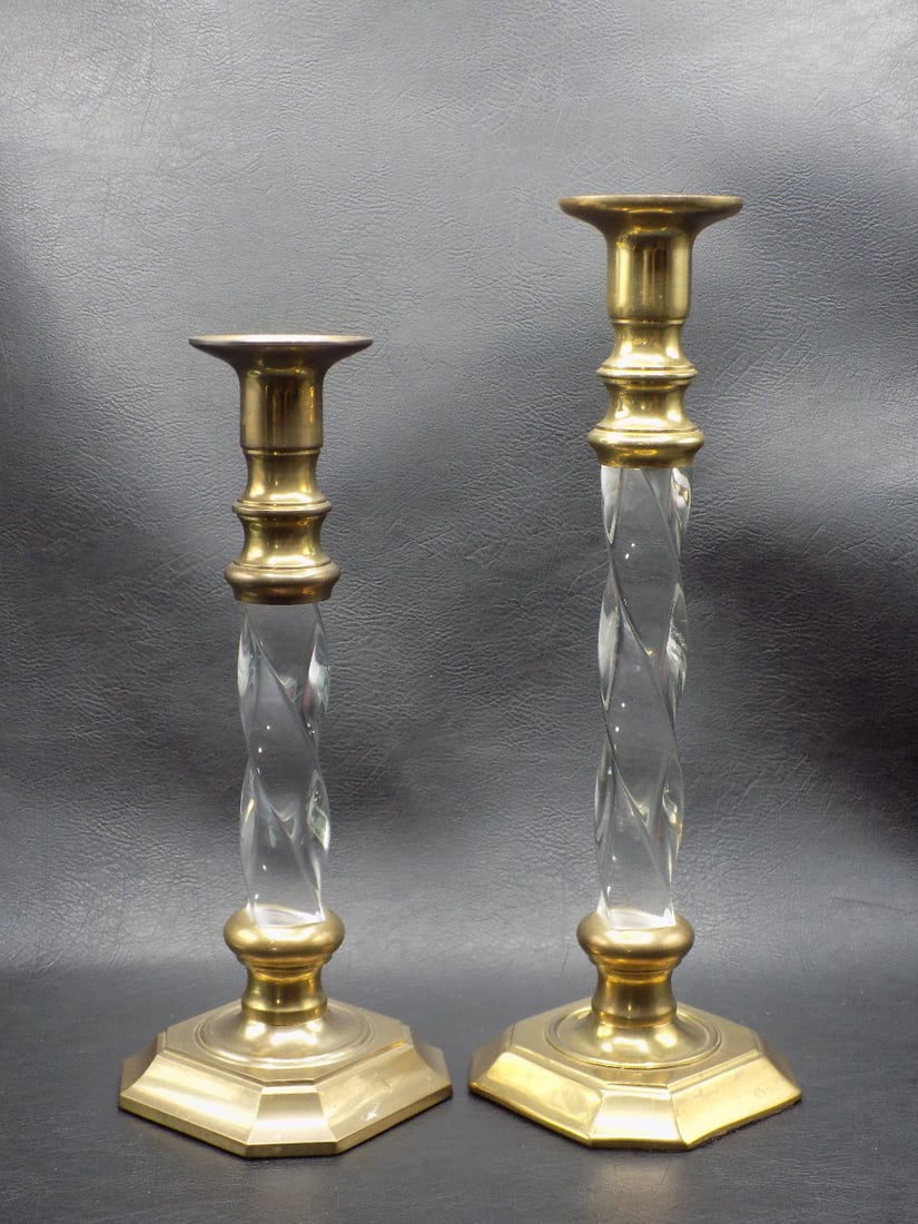Matching brass candlesticks. Different sizes: Matching brass candlesticks. Different sizes. Center acrylic. In very good original as found condition. Great quality and detail. Tallest 11 ¾ inches tall. Other is 10 inches.