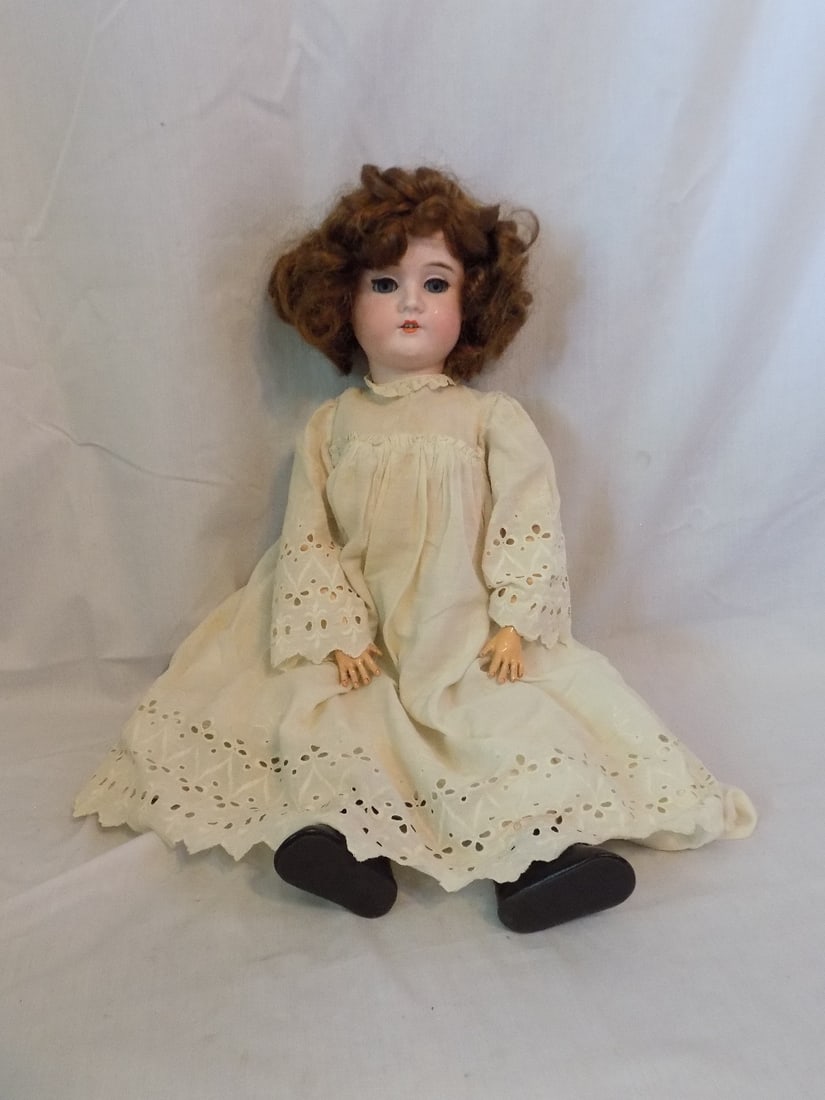 Antique German Viola H and Co doll: Antique German Viola H and Co doll. Porcelain with jointed body. We believe it is Heubach and Company. Old clothing Please see photos. In very good original as found condition. 24 inches tall