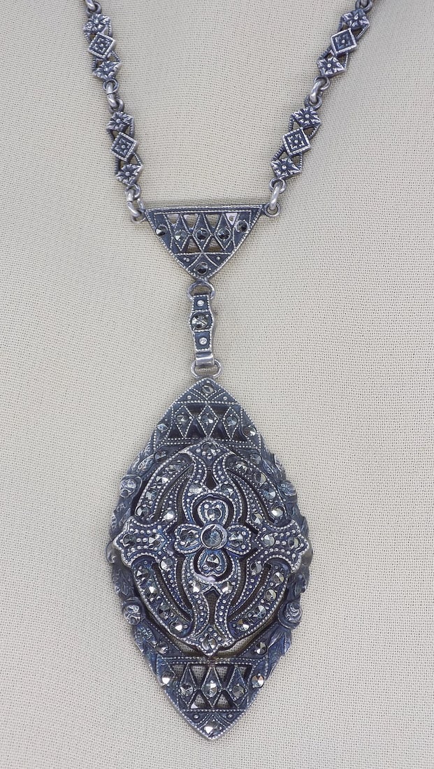 Elegant vintage sterling silver with marcasite necklace.: Elegant vintage sterling silver with marcasite necklace. Great quality and detail. In very good original as found condition. Pendant 1 ¾ tall. Chain 17 ½ total length