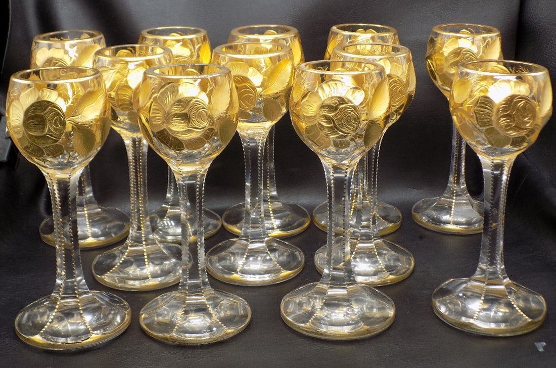 12 vintage nicely Intaglio cut gold decorate Moser wine glasses: 12 vintage nicely Intaglio cut gold decorate Moser wine glasses. Beautiful colors. Intaglio cut and gold decorated flowers. Great quality and detail. 8 ½ inches tall