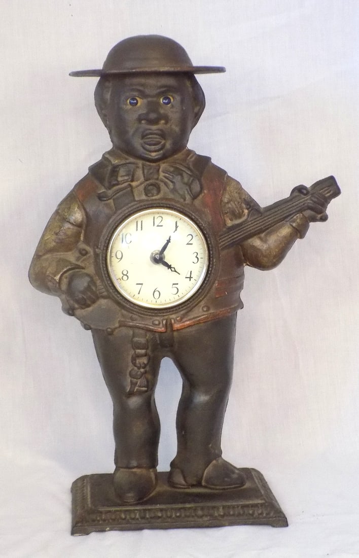 Antique cast iron figural clock with man playing banjo (1 of 6)
