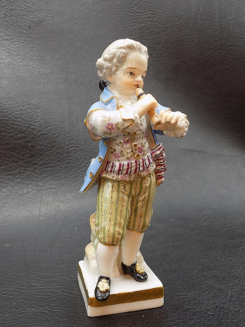 Charming antique Meissen porcelain figure of boy playing instrument: Charming antique Meissen porcelain figure of boy playing instrument. Signed on bottom as shown in photos. Beautiful hand decorated colors. Great quality and detail. In very good original as found cond